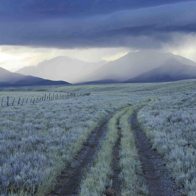 Rain showers over sagebrush-steppe at the foot of the Sawtooth Mountains in Clark County, Idaho.