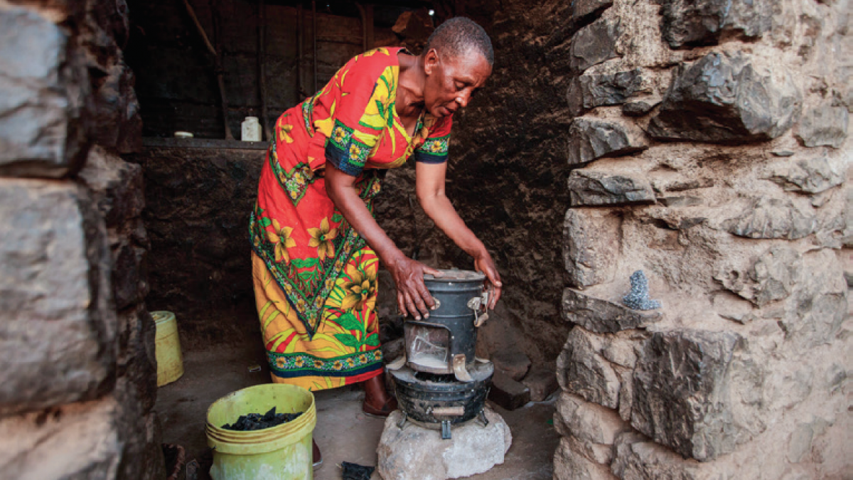 Julieth Mollel, 61, prepares to cook dinner on her clean cookstove at her home near Arusha, Tanzania.