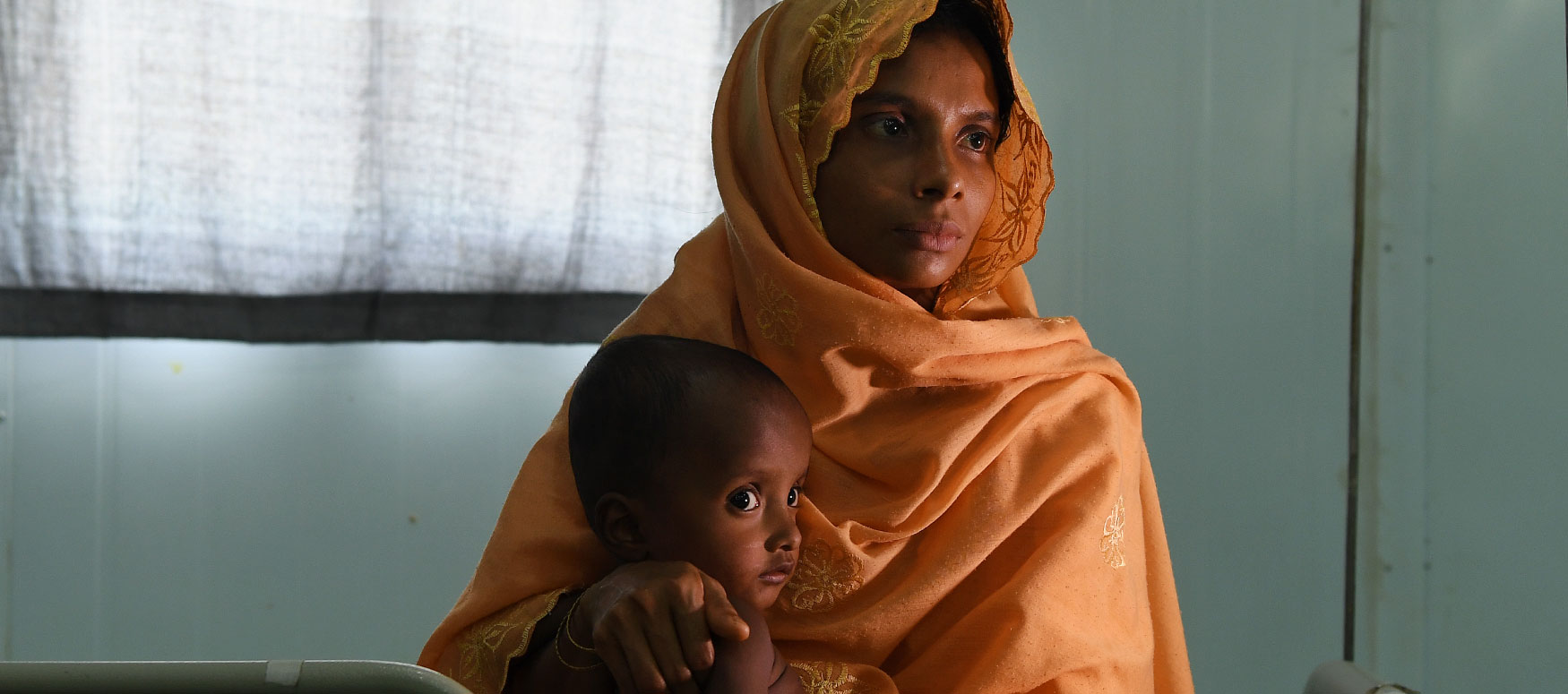 Khadiza, a 22-year-old Rohingya refugee, holds her 12-month-old son, Mohammad Haris, who is being treated for malnutrition at the Medecins Sans Frontieres hospital in the Kutupalong refugee camp in Bangladesh.